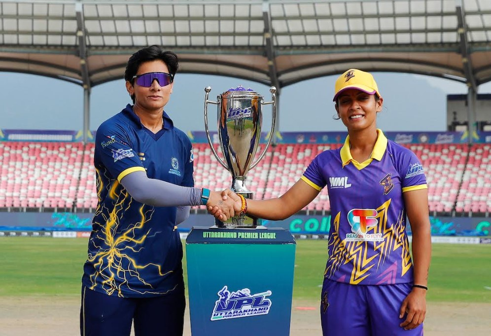 Captains Mansi Joshi and Amisha Bahukhandi pose with the trophy