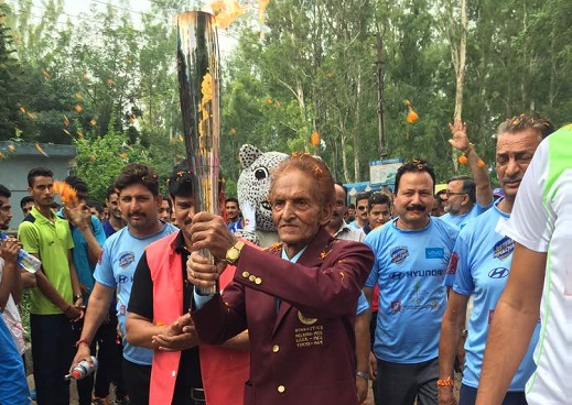 Anant Ram with the Olympic Torch