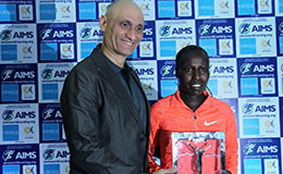 Florence Kiplagat with AIMS WORLD RECORD AWARD