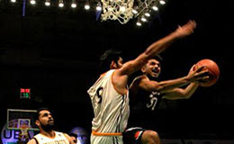 Delhi Capitals shooting guard Vinay Kaushik draws contact against Ranbir Singh of Mumbai Challengers