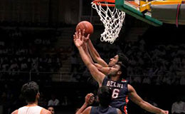 Mumbai Challengers Nikhil and Delhi Capitals Ajay fight for possession in UBA Pro Basketball League match