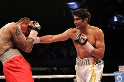 Vijender Singh punching Matiouze Royer