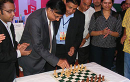 Mr Ashok Chauhan Founder Amity Group making inaugural move of the Championship Also present top seed Abhijeet Gupta Shri Bharat Singh Shri DV Sundar and Grandmaster Koneru Humpy