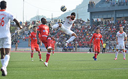 Aizawl FCs Alfred Kemah jostles for the ball against Sporting Goas Pratesh Shirodkar