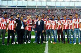 Atletico de Kolkata team and officials at the Vicente Calderon Stadium with the ISL Trophy