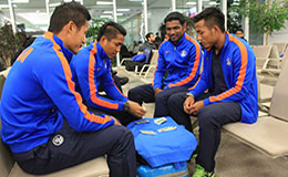 Indian National Team Players play cards at the Ashgabat Airport