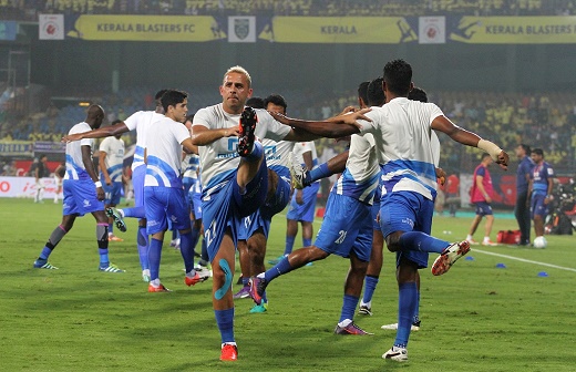 Kerala Blasters FC players warm up Saturday