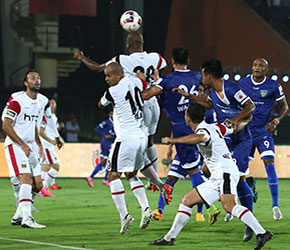 NorthEast United FC and Chennaiyin FC players in action vie for the aerial ball