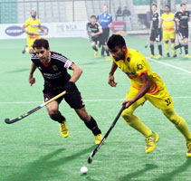 Chandanda-Thimmaiah-of-IND-in-action-against-GER-in-their-HHWL-Men-Final-2014
