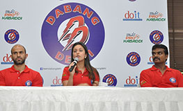 Ms Radha Kapoor Middle speaks at the new Dabang Delhi logo unveiling ceremony with Sports Scientist Dr Sandeep Kumar left chief coach Honnappa Gowda Chief Coach