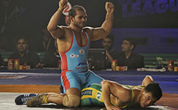 Bengaluru Yodhas marquee player Narsingh Yadav exults after claiming a 9 1 victory over Purevjav Unurbat
