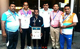 Wrestler Monu after winning medal with his coaches